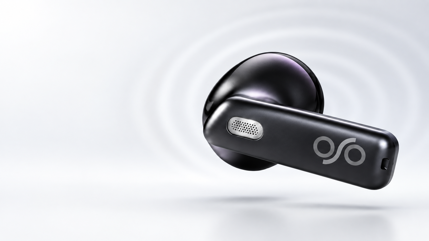 Dark chrome gray OSO² earbud macro view with a gray logo and a detailed microphone grille